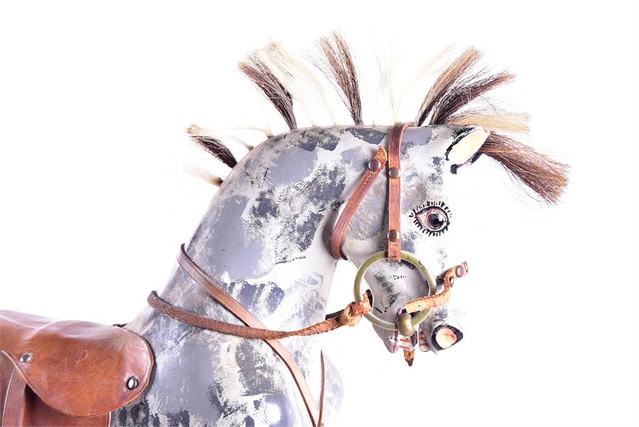 An Edwardian painted rocking horse on a blackened swinging frame, the dappled grey mount adorned - Image 9 of 9