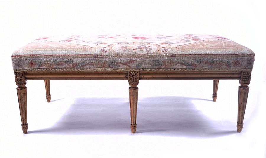 A gilt painted upholstered stool with needlework upholstery, the frame, supported on six fluted - Image 4 of 4