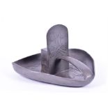 An Art Nouveau Liberty Tudric pewter matchbox stand of shaped form with embossed leaves, and strap