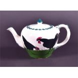 A Wemyss teapot decorated with hand painted hens on a grassy ground the black hens with red combs