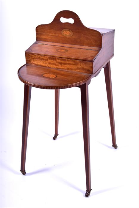 An unusual Edwardian mahogany inlaid valet stand with shell inlay, and two hinged lidded