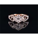 An 18ct rose gold and diamond floral cluster ring centred with a floral cluster of seven diamonds,