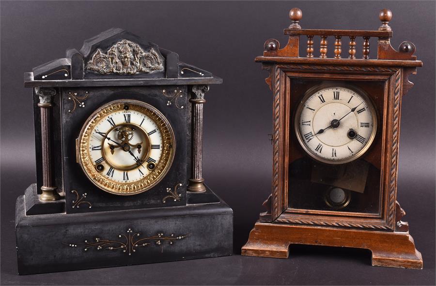 A Victorian black slate mantel clock together with a 1930's oak cased mantel clock (2).