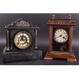 A Victorian black slate mantel clock together with a 1930's oak cased mantel clock (2).