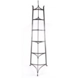 A 19th century graduating ironwork pan stand / tower the simple three-legged frame with scrolling