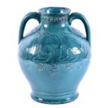 A large twin-handled Della Robbia pottery vase of globular form in a turquoise glaze, decorated with