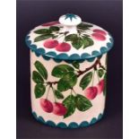 A lidded cylindrical Wemyss biscuit barrel hand painted to exterior and lid with cherries, set