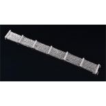 An 18ct white gold and diamond bracelet comprising of seven rectangular post segments inset with