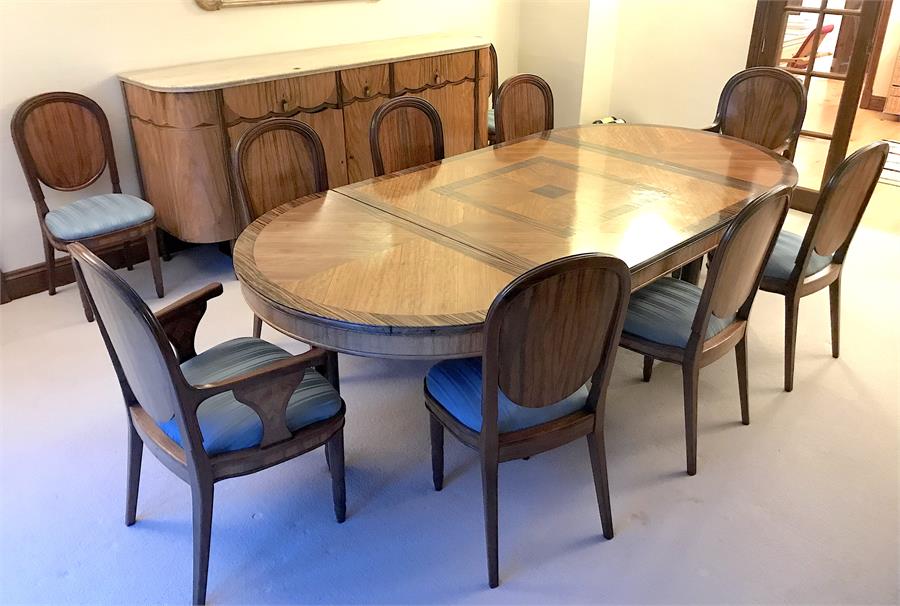 A 1930's French walnut and coromandel dining room suite comprising a dining table, eight dining