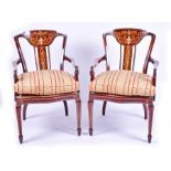 A pair of Edwardian rosewood and ivory inlaid armchairs the backs finely inlaid with boxwood and