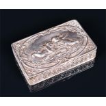 A silver trinket box of rectangular form, the hinged lid repousse decorated with cherubs, gilt