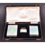 Walker & Hall, Sheffield. A silver and enamel cigarette case and compact set together with