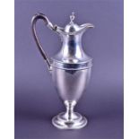 A George III silver hot water jug by Hester Bateman London 1785, with duty stamp, the baluster ovoid