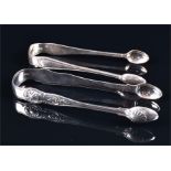 Two pairs of Victorian silver sugar tongs, variously decorated London 1865 & 1873, by Chawner &