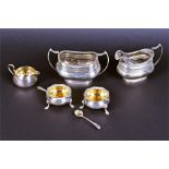 An assortment of silver comprising a milk jug and two handled sugar bowl Sheffield 1918, by Albert
