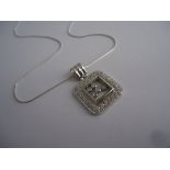 18K white gold large square pendant with 5 floating diamonds in the center and surrounded by 50