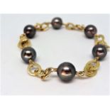 6x 8mm black tahitian pearls 18k yellow gold lobster claw clasp 7.5'' length