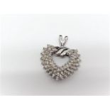 Diamond heart pendant in 14k white gold. Approx. 55 diamonds.