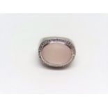 Modern coktail ring with a milky rose quartz in halo design set in 18k white gold. 40 diamonds. Size