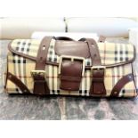 Authentic Burberry Haymarket Check coated canvas buckle satchel handbag. Features gold-tone