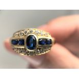 14K yellow gold Signed '585' for 14K. High grade cubic zirconia and lab created sapphires.