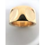 Louis Vuitton band style ring composed of 18k Yellow Gold and prominently featuring a LOUIS
