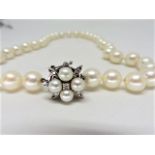 40x 88.5mm freshwater pearls 4 x 5mm freshwater pearls 5 diamonds.14k white gold 16" length.