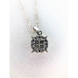 14K white gold 18" chain. Total diamond weight approx.: 0.25 CT.