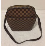 Authentic Louis Vuitton Ipanema GM shoulder bag in brown Damier canvas. Top is secured with double