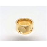 Louis Vuitton band style ring composed of 18k Yellow Gold and prominently featuring a LOUIS