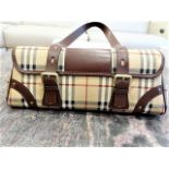 Authentic Burberry Haymarket Check coated canvas buckle satchel handbag. Features gold-tone