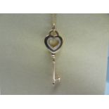 Tiffany 18K rose gold heart key pendant