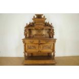 Walnut "Narren" cabinet with marble top, carving with dragons and fools, two drawers en three doors,