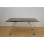 Tecno dinner table, model Nomos with metal legs, en glass top, designer Norman Foster, h. 72, w.