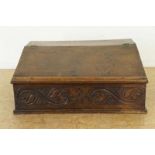 Oakwood writing desk with carved panel, h. 32, w. 74, d. 53 cm. Eiken lezenaar met gestoken front,