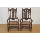 Stel gestoken eiken ridder fauteuils met rieten zitting, 19e eeuw Two Dutch oak 'knight chairs' with