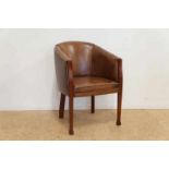 Hoefvormige fauteuil overtrokken met leer, rustend op houten poten A horseshoe shaped leather chair,