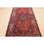 Tapijt: Belouch 230 x 123 cm. -Herkomst: 'Grands Magasins de la Bourse Tapis d'Orient' A carpet,