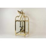 Bronzen 8-lichts hallamp met beglazing rondom, h. 90 cm. A brass 8-light chandelier with glass