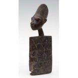 Yoruba, wooden doll, omo langidi, flat rectangular body with engraving, the finely carved buste on a