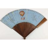 Paper and rosewood hand fan. With painted scene on two sides of an hot air balloon and a scene of