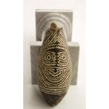 PNG, Papua Golf, coconut charm, marupai, with delicately notched patterns bordering an