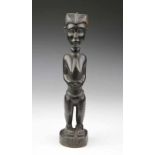 Ivory Coast, Baule, standing female figure with black patina. h. 34 cm. [1]