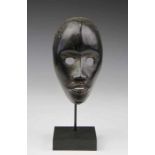 Ivory Coast, Dan, face mask with circular open eyes, flat nose and open mouth with protruding