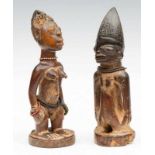 Nigeria, Yoruba, two twin figures, Ibeji; one female figure with scarification's on belly and the