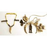 Dayak, necklace and Philippines, necklace; Dayak with glass beads, tooth and two wooden amulets.