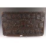 An antique carved wooden panel with coat of arms 'Bourgondische Kreiss'. 17th century style. 40 x 77
