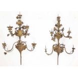 A pair of Italian gilded wrought iron wall appliques with six arms and decoration of acanthus