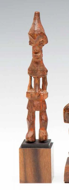 DRC, Benelulua, wooden figure, with enlarged eyes, conical head and painted in red. h. 15,5 cm. [1]
