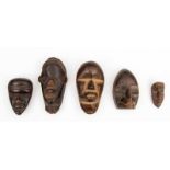 Ivoorkust-Liberia, five miniature Dan masks. h. 5 - 12 cm. [1]